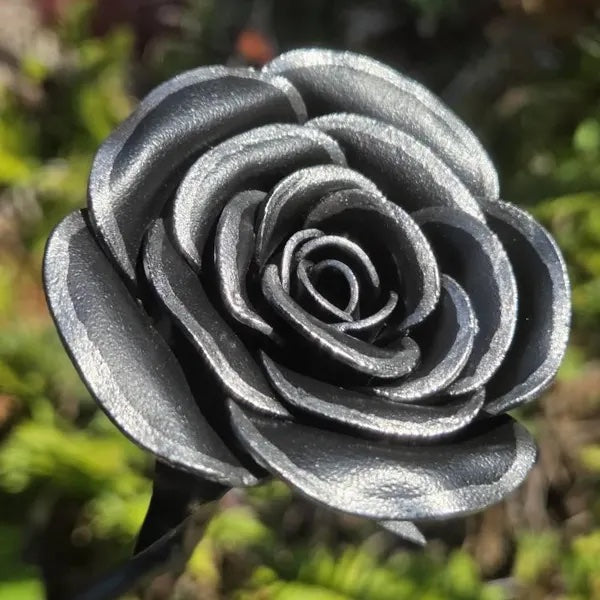 Metallic rose against a blurred green background