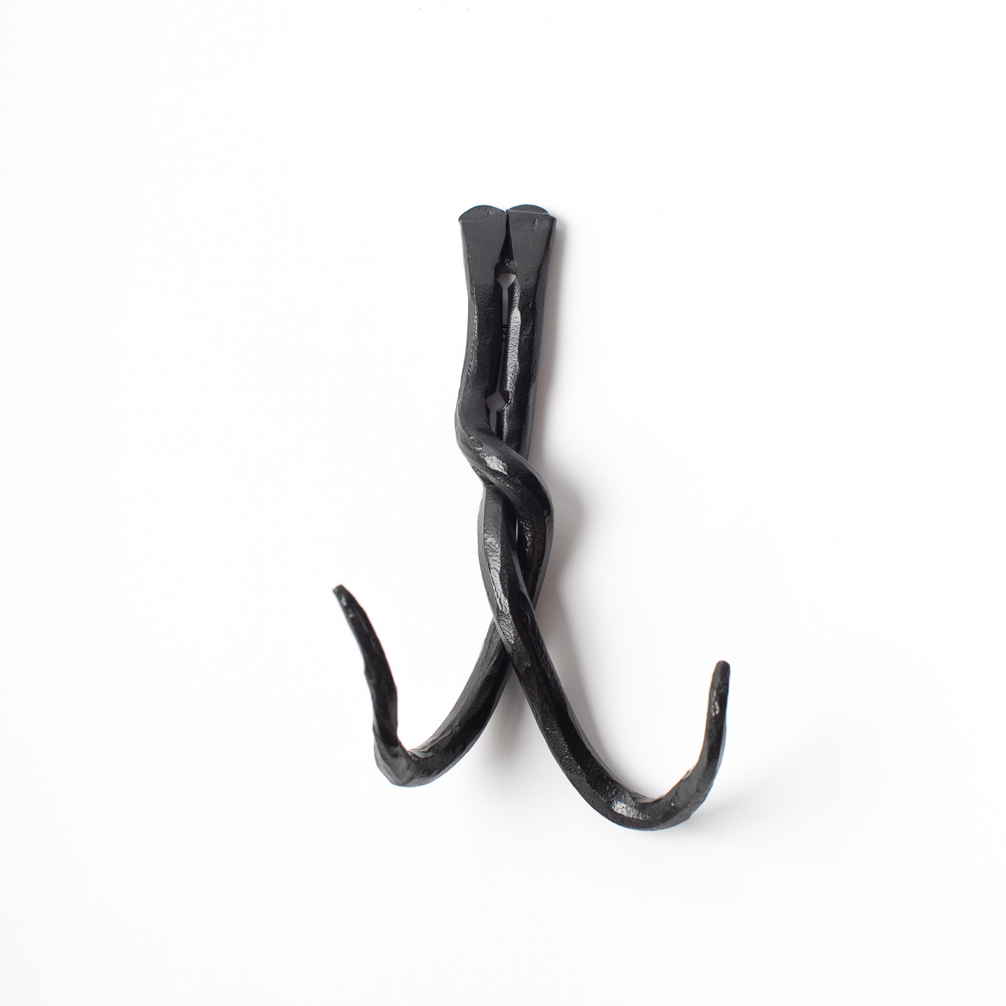 An Urban Forge Black River hand-forged iron double hook in a black finish. The hook is pictured against a white backdrop.