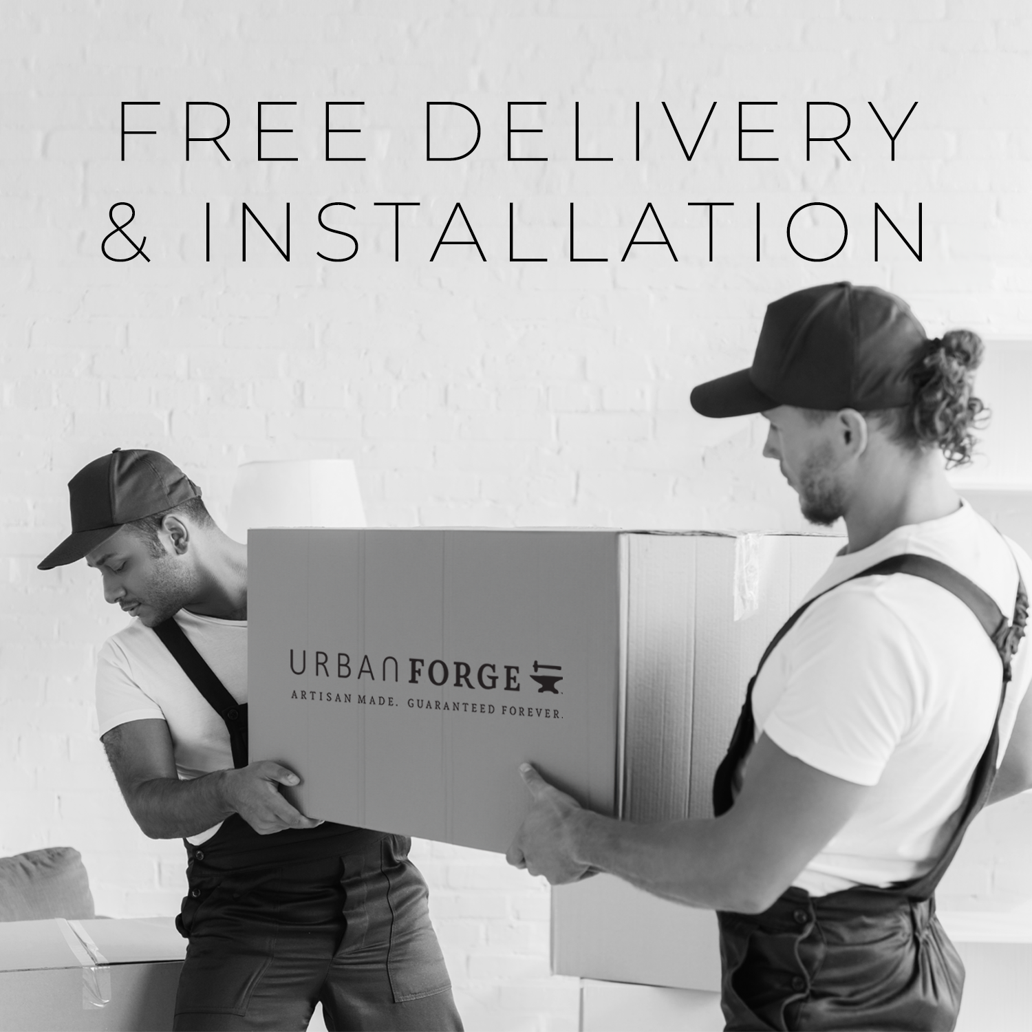 Two furniture movers delivering a package from Urban Forge.