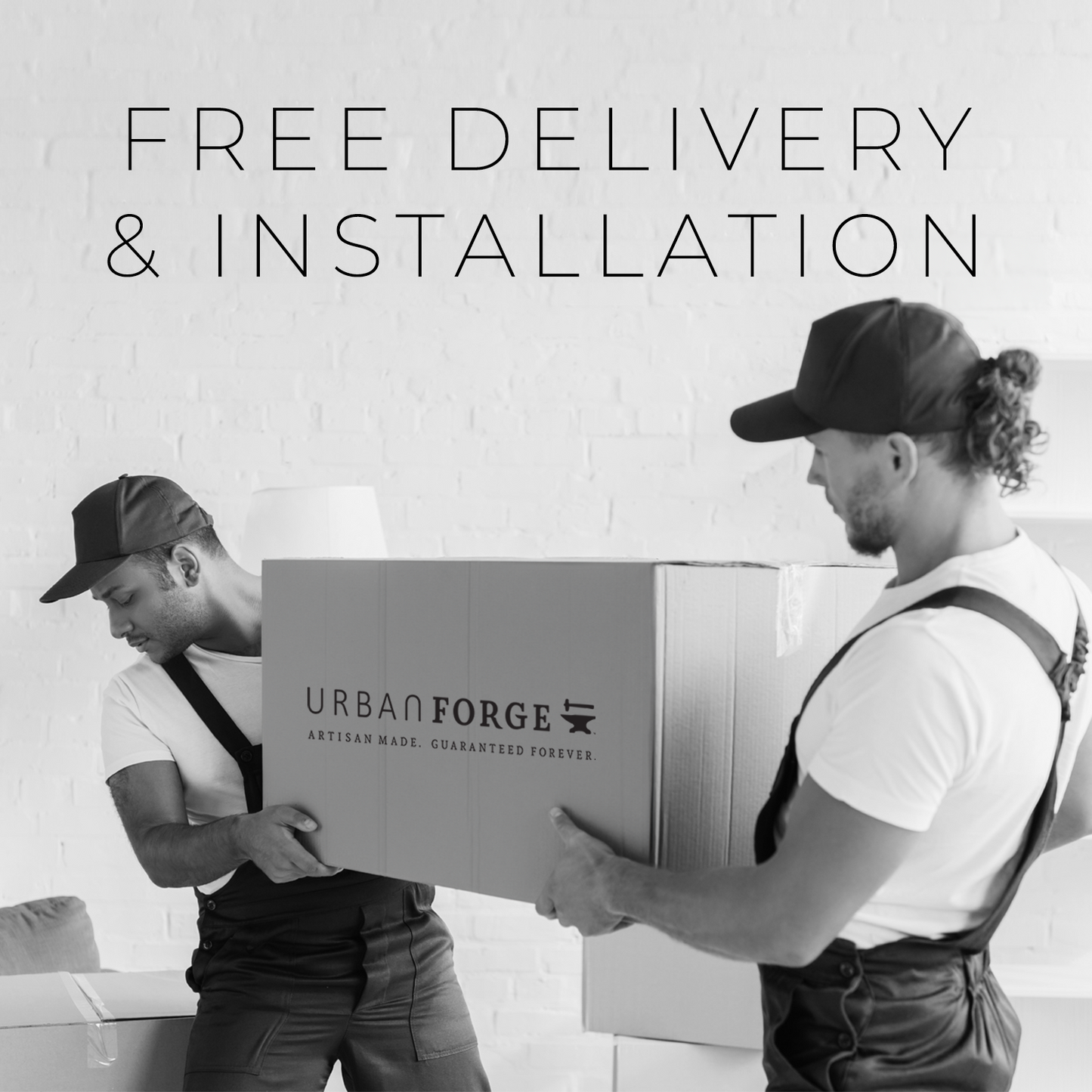 Two furniture movers delivering a package from Urban Forge.