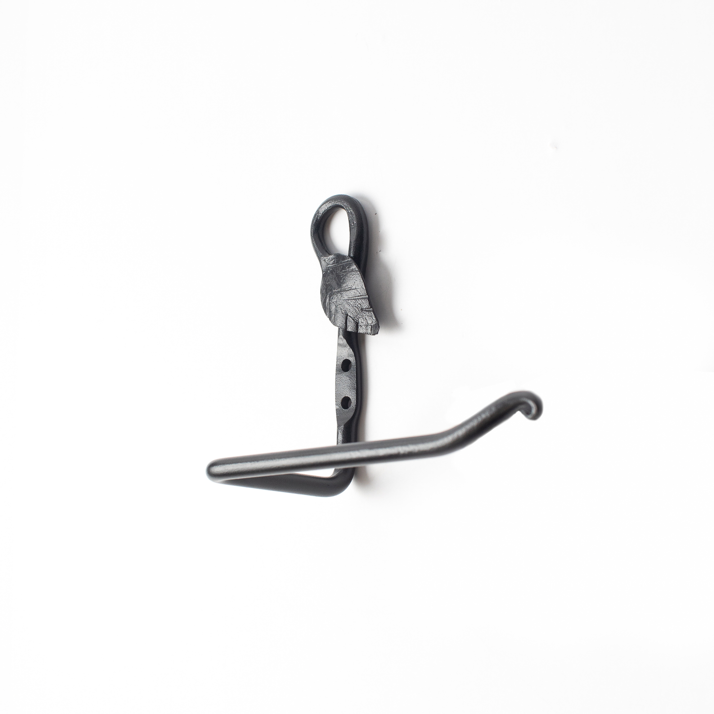 The Urban Forge Leaf toilet paper holder in a black finish. The toilet paper holder is pictured against a white backdrop.