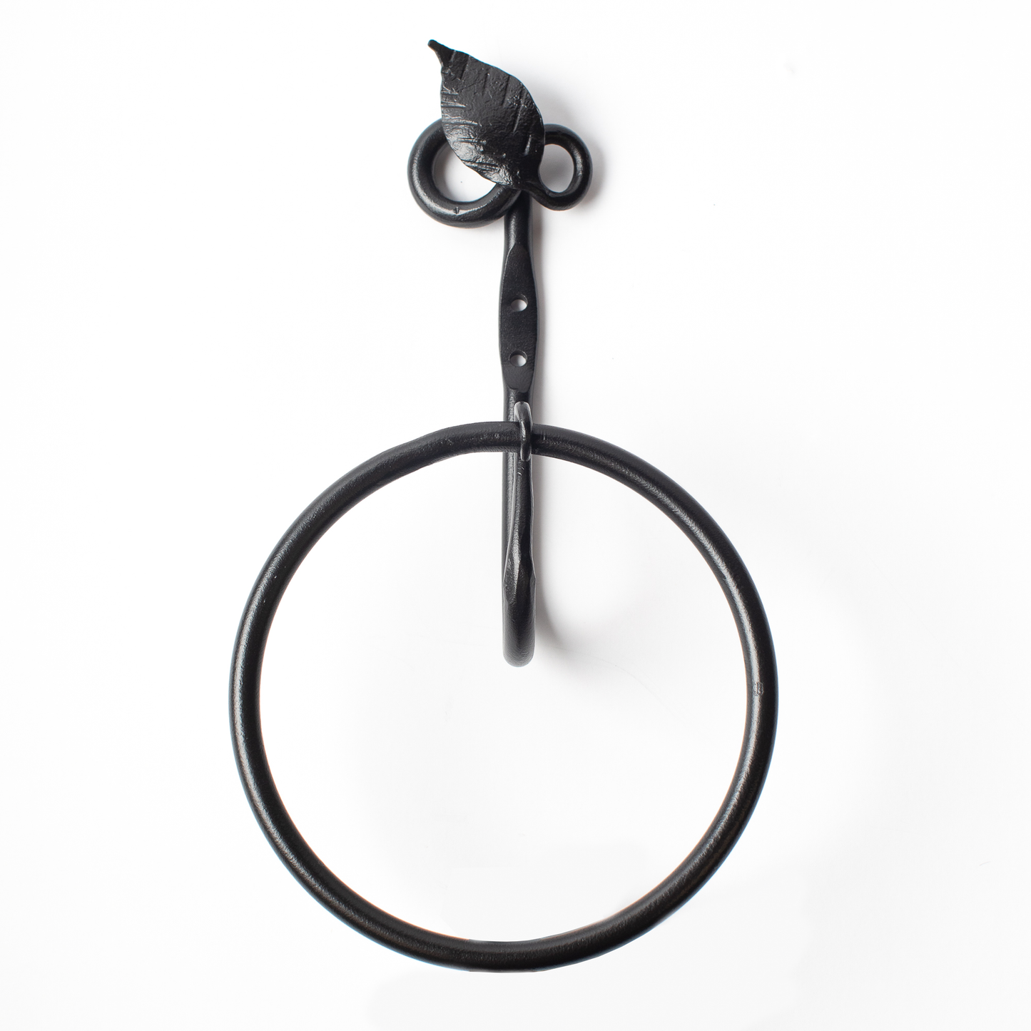 The Urban Forge Leaf towel ring in a black finish. The towel ring is pictured against a white backdrop.