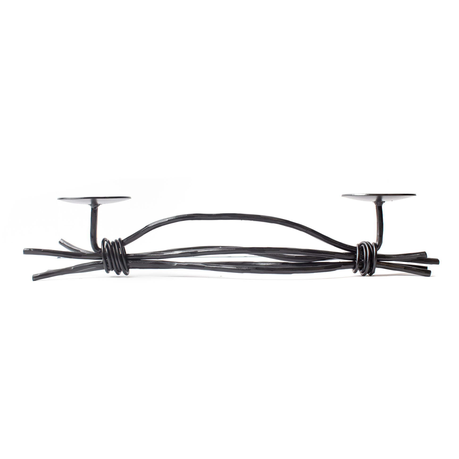 An Urban Forge Black River hand-forged iron double candle holder in a black finish. It's pictured against a white backdrop.