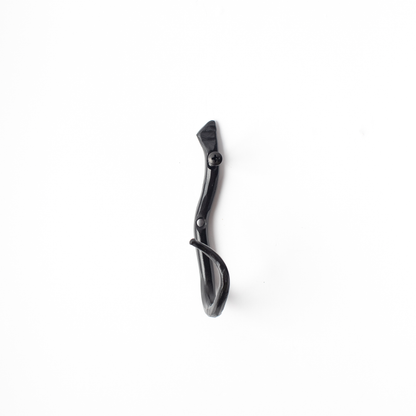An Urban Forge Black River hand-forged iron single hook in a black finish. The hook is displayed against a white backdrop.
