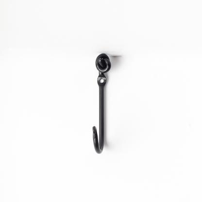 An Urban Forge Knot hand-forged iron single hook in a black finish. The hook is pictured against a white backdrop.